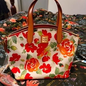 Dooney & Bourke floral purse. White with red and orange flowers, red interior.